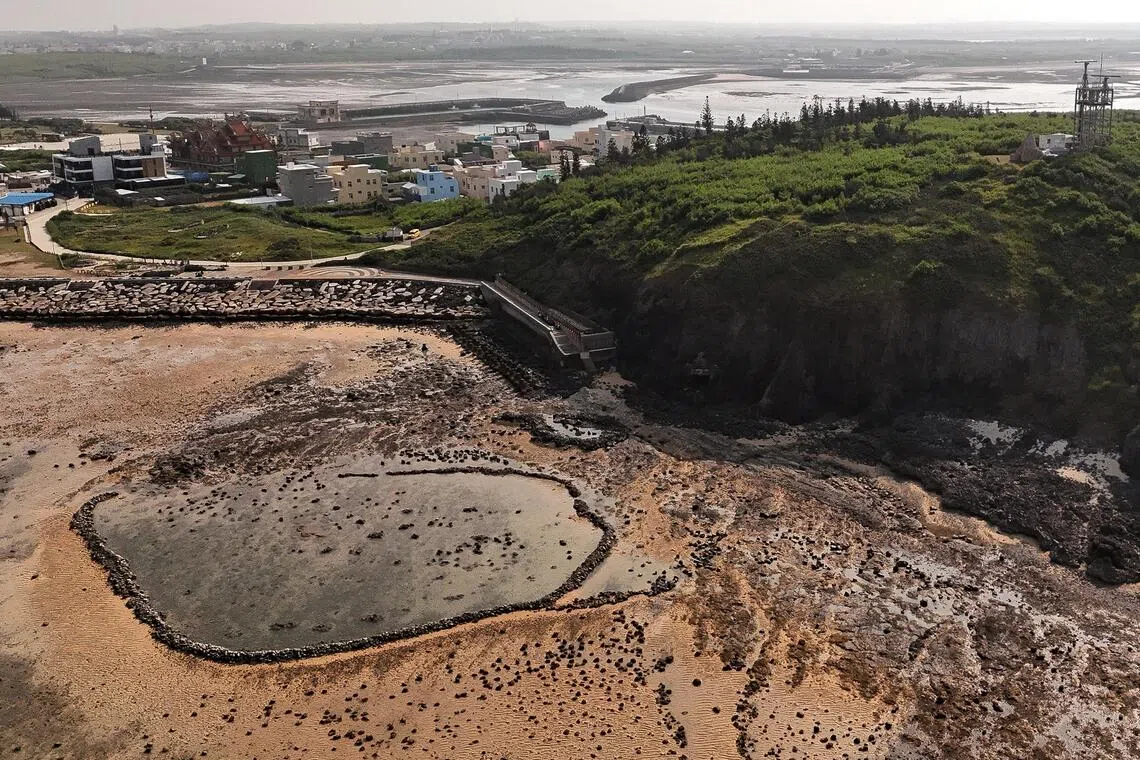 A drone view shows a traditional stone fish weir on the coast of Penghu, Taiwan.