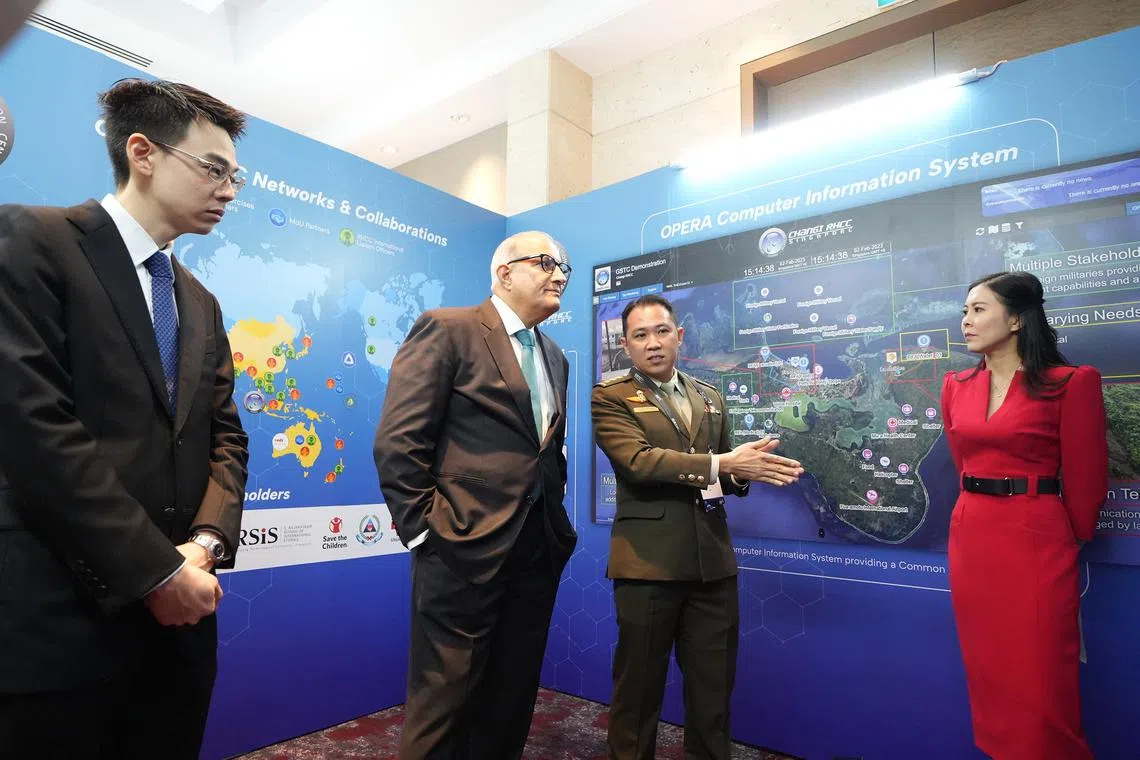Minister-in-charge of Trade Relations S. Iswaran touring the exhibits at the Global Space and Technology Convention on Wednesday. He is accompanied by (from L) Singapore Space and Technology Limited (SSTL) executive chairman Jonathan Hung, COL Fredie Tan, director of Changi Regional Humanitarian Assistance and Disaster Relief Coordination Centre and SSTL chief executive Lynette Tan.