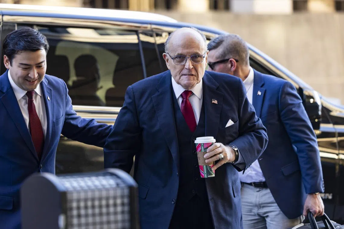 Former Trump lawyer Rudy Giuliani (centre) arrives at the Washington district court for the hearing, on Dec 15, 2023.