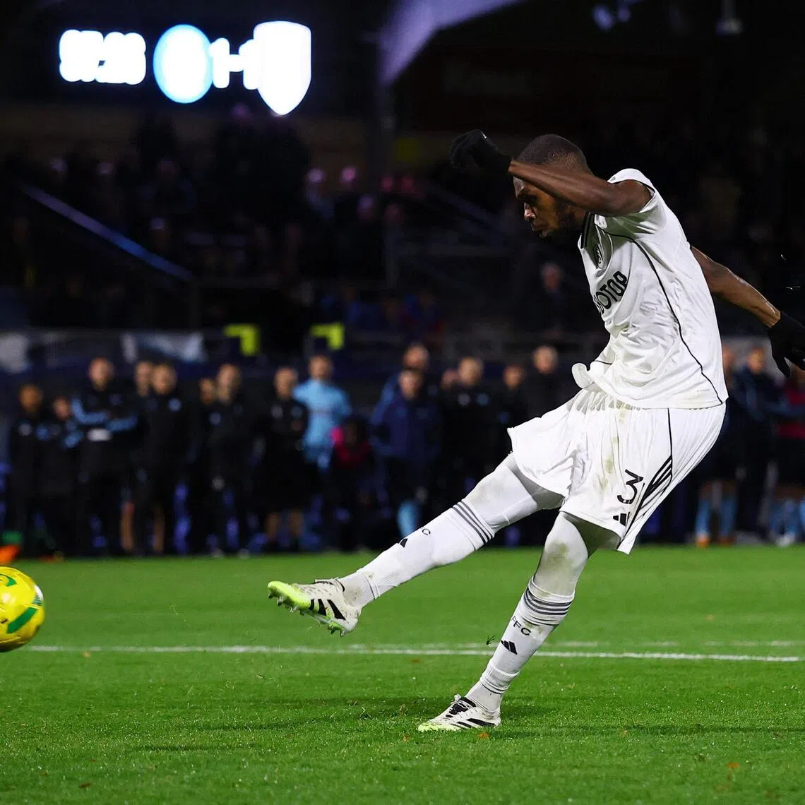 Fulham's Issa Diop scoring the winning penalty during the League Cup last-16 penalty shoot-out win over Wycombe Wanderers at Adams Park on Oct 28, 2025. The Cottagers prevailed 5-4 after the match ended 1-1.