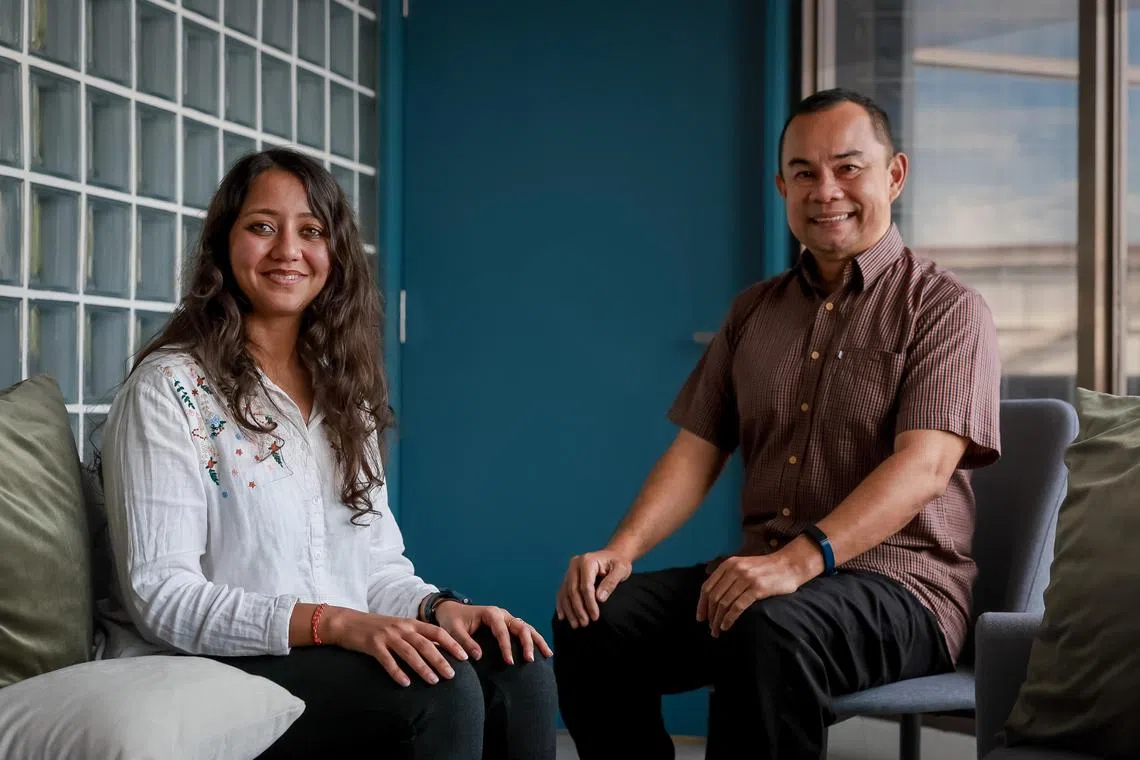 ComLink  family coaches Mohamad Ali A Wahab (brown top) and Surbhi Sharma (white top) at the graduation ceremony for the inaugural run of the Foundation Programme held at the Common Ground Civic Centre & Consultancy Auditorium in Bedok on Aug 8, 2024.