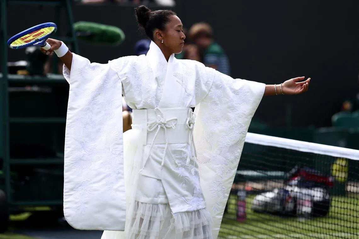 Japan’s Naomi Osaka warms up ahead of her women’s singles first round match on the first day of the 2026 Wimbledon Championships.