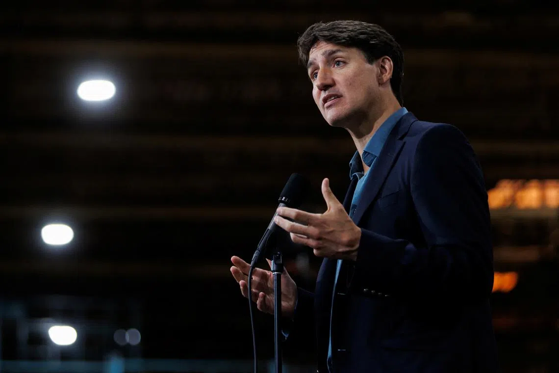 FILE PHOTO: Canada's Prime Minister Justin Trudeau speaks to the media during an announcement at the Goodyear Canada Inc tire production plant in Napanee, Ontario, Canada August 12, 2024.  REUTERS/Cole Burston/File Photo