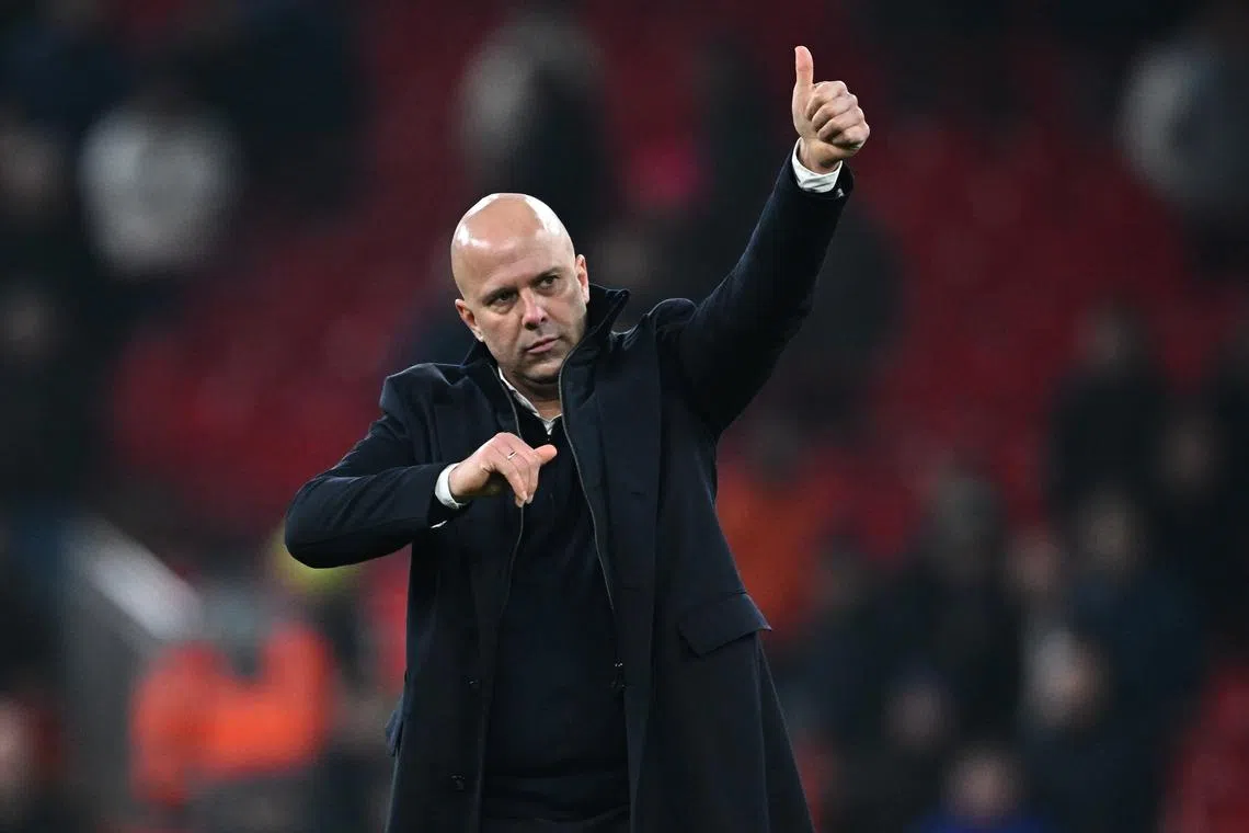 Soccer Football - Carabao Cup - Semi Final - Second Leg - Liverpool v Tottenham Hotspur - Anfield, Liverpool, Britain - February 6, 2025 Liverpool manager Arne Slot celebrates after the match REUTERS/Dylan Martinez