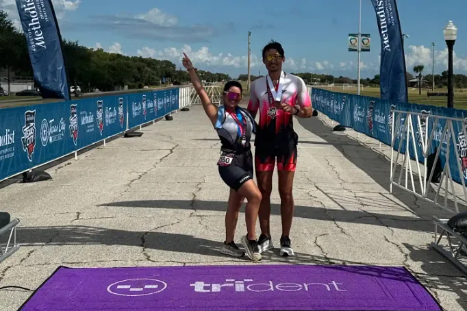 Ms Elizabeth Lopez-Aguilar completing a triathlon with her boyfriend, Mr Abraham Tahtouh.