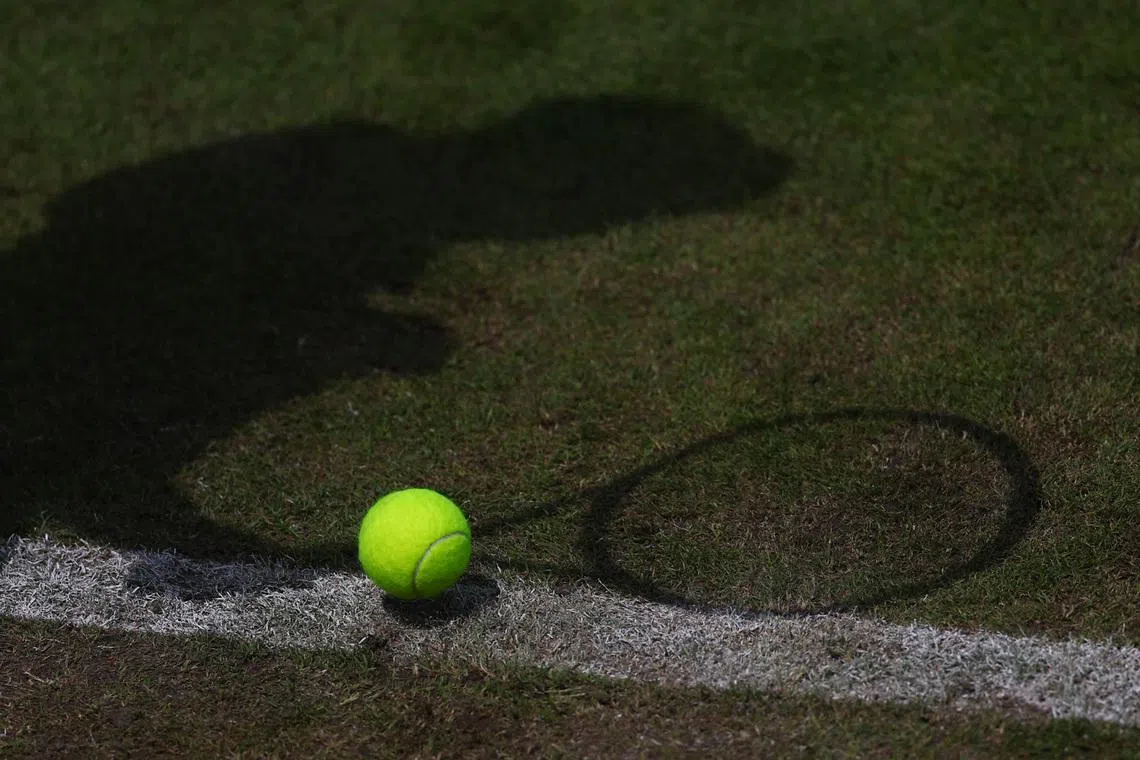Tennis - WTA 250 - Birmingham Classic - Edgbaston Priory Club, Birmingham, Britain - June 21, 2023 General view of a tennis ball pictured alongside a player's shadow. Action Images via Reuters/Carl Recine
