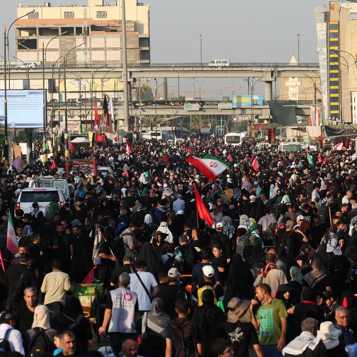 Shi’ite Muslim pilgrims in Najaf, Iraq walking towards the holy city of Kerbala ahead of the ritual of Arbaeen on July 31.