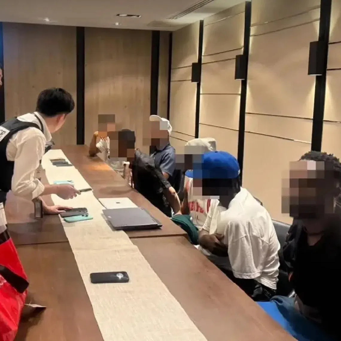 Police seized devices that contained alleged scam scripts and AI-generated profile images.
