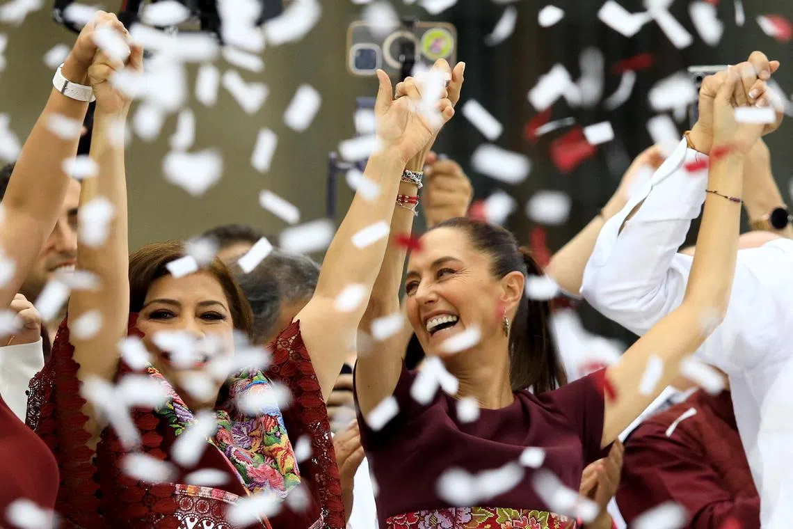 Presidential candidate of the ruling MORENA party Claudia Sheinbaum holds hands with Mexico City mayoral candidate of MORENA party Clara Brugada, during her closing campaign rally at Zocalo Square, in Mexico City, Mexico, May 29, 2024. REUTERS/Raquel Cunha