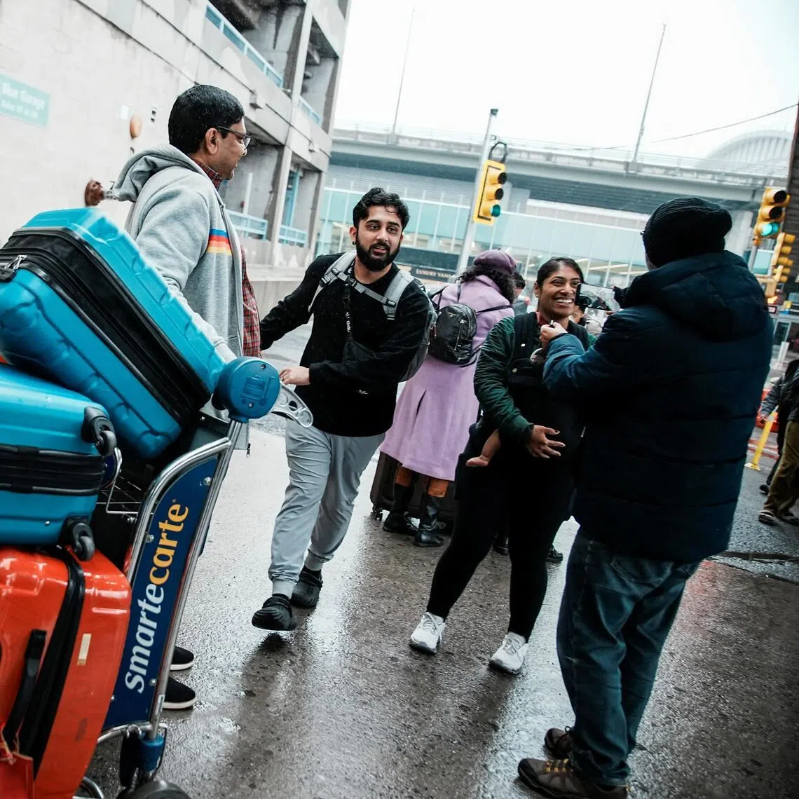 People arriving back in the US from the Middle East on March 5, after taking a US government chartered flight to New York.