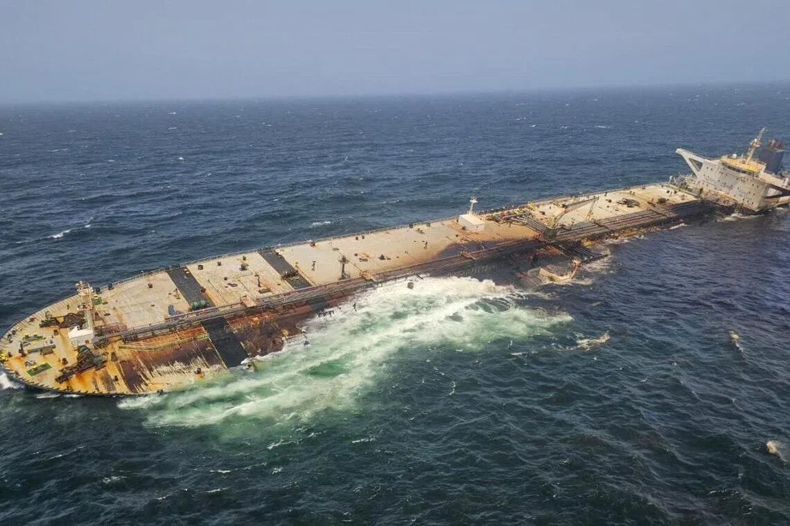 The damaged and half-sunk oil tanker Caroline Bezengi off the coast of Oman.