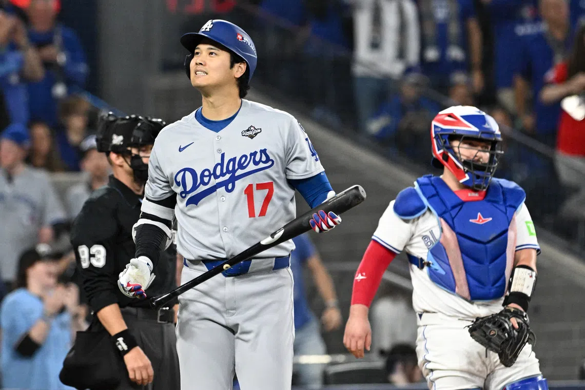 Oct 24, 2025; Toronto, Ontario, CAN; Los Angeles Dodgers designated hitter Shohei Ohtani (17) reacts after striking out against the Toronto Blue Jays dfifth inning during game one of the 2025 MLB World Series at Rogers Centre. Mandatory Credit: Dan Hamilton-Imagn Images