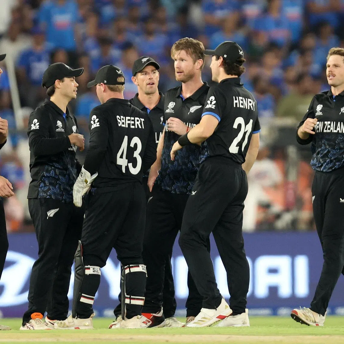 Cricket - ICC Men's T20 World Cup 2026 - Final - India v New Zealand - Narendra Modi Stadium, Ahmedabad, India - March 8, 2026 New Zealand's Jimmy Neesham celebrates with teammates after taking the wicket of India's Ishan Kishan REUTERS/Amit Dave