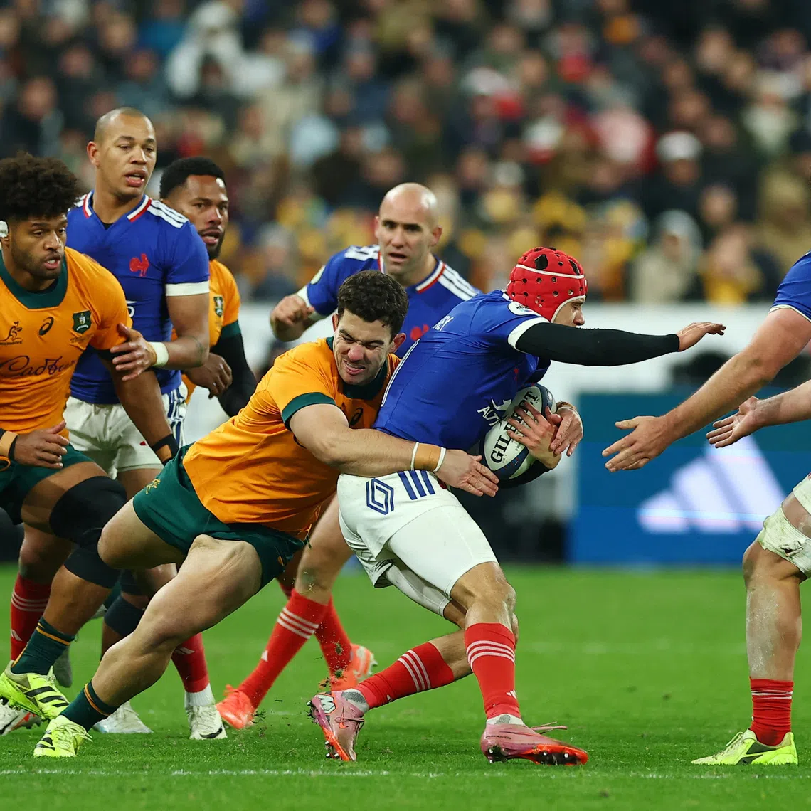 Rugby Union - Autumn Internationals - France v Australia - Stade de France, Saint-Denis, France - November 22, 2025 France's Louis Bielle-Biarrey in action with Australia's Josh Nasser REUTERS/Gonzalo Fuentes