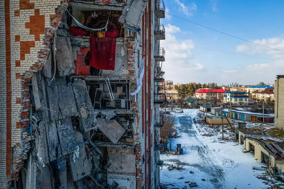 TOPSHOT - This aerial photograph shows a damaged residential building in the town of Lyman, Donetsk region, on February 22, 2023, amid Russia's military invasion on Ukraine. (Photo by Ihor TKACHOV / AFP)