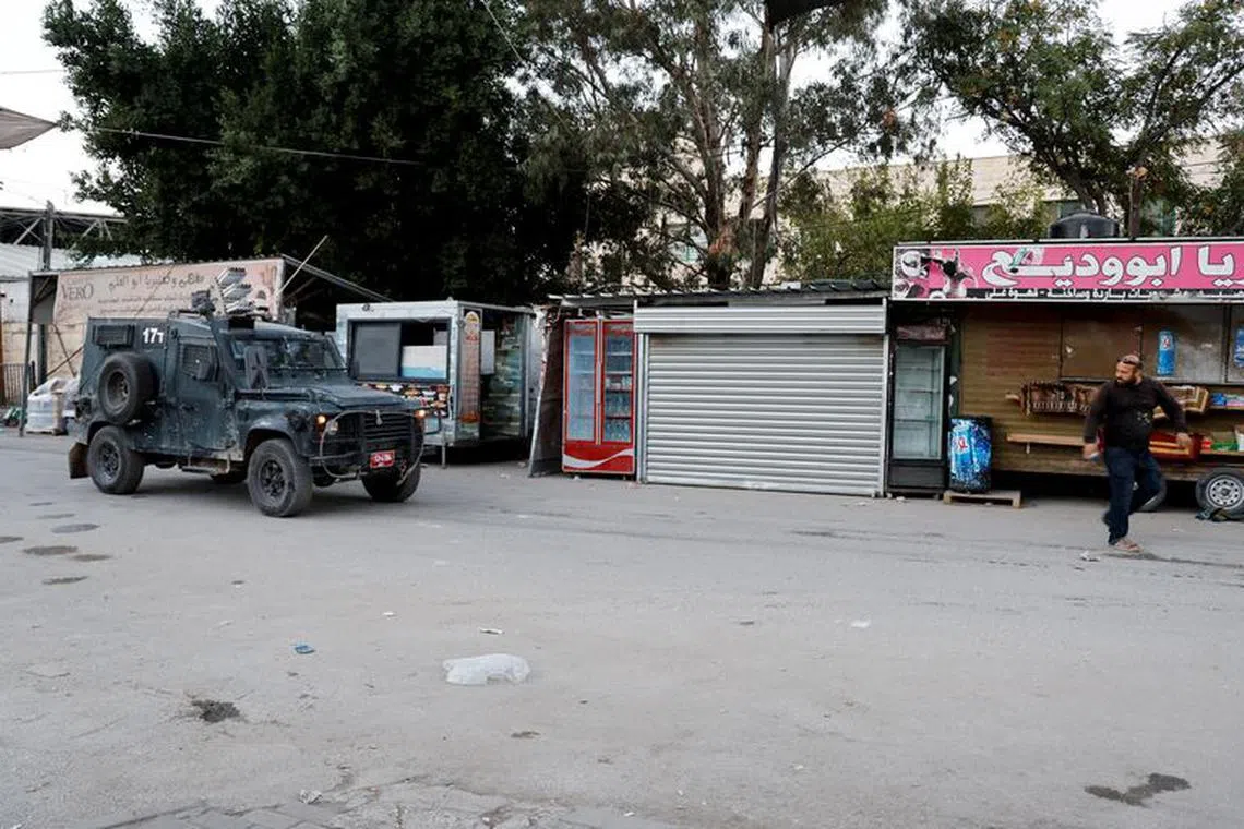 FILE PHOTO: An Israeli army vehicle operates during an Israeli raid in Jenin, in the Israeli-occupied West Bank, November 9, 2023. REUTERS/Raneen Sawafta/File photo