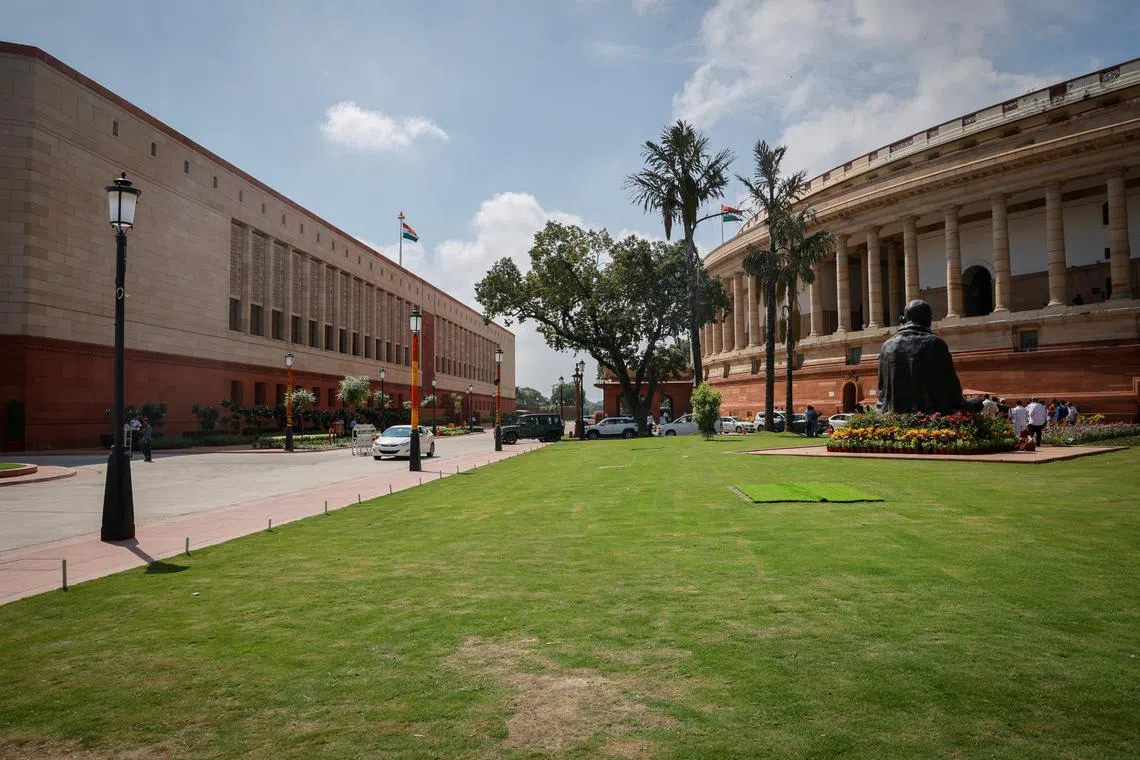 FILE PHOTO: A view shows India's new (L) and old parliament buildings in New Delhi, India, September 18, 2023. REUTERS/Adnan Abidi/File Photo