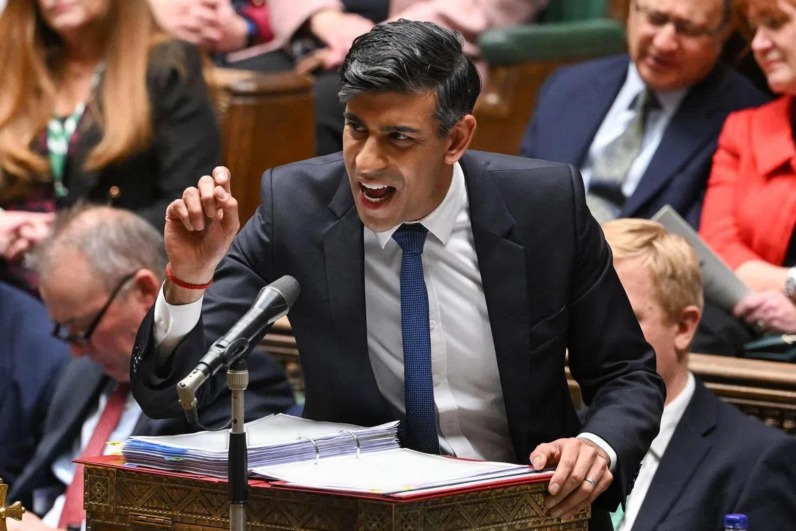 TOPSHOT - A handout photograph released by the UK Parliament shows Britain's Prime Minister Rishi Sunak speaking during the Prime Ministers' Questions (PMQs) in the House of Commons, in London, on December 13, 2023. (Photo by JESSICA TAYLOR / UK PARLIAMENT / AFP) / RESTRICTED TO EDITORIAL USE - NO USE FOR ENTERTAINMENT, SATIRICAL, ADVERTISING PURPOSES - MANDATORY CREDIT " AFP PHOTO / Jessica Taylor / UK Parliament"