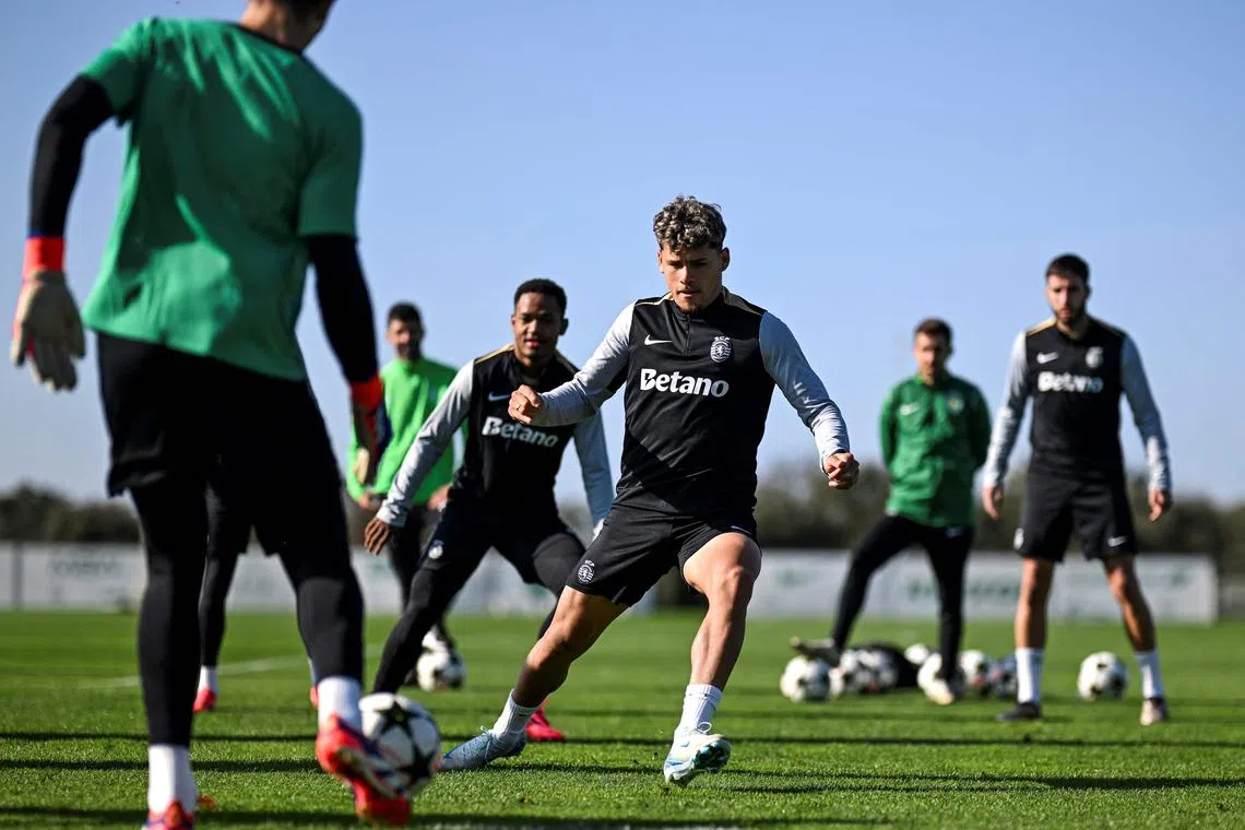 Sporting's Uruguayan defender Maxi Araujo (centre) attending a training session on the eve of their Champions League football match against Arsenal at the Cristiano Ronaldo Academy in Alcochete, outskirts of Lisbon, on Nov 25.