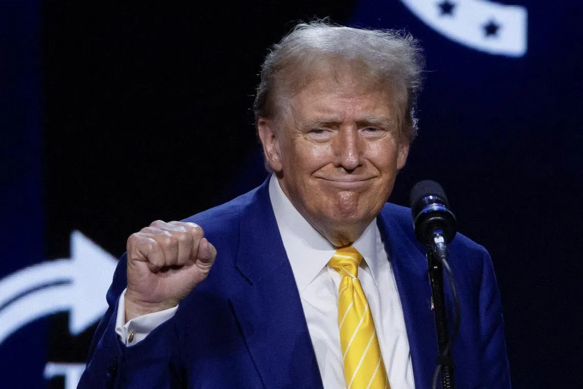 FILE PHOTO: Republican presidential candidate and former U.S. President Donald Trump gestures during a Turning Point USA event at the Dream City Church in Phoenix, Arizona, U.S., June 6, 2024. REUTERS/Carlos Barria/File Photo