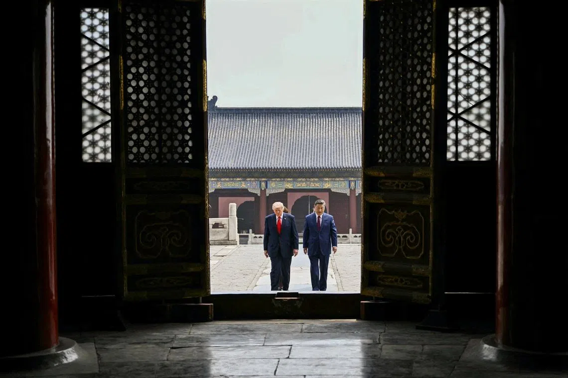 China's President Xi Jinping and US President Donald Trump visiting the Temple of Heaven in Beijing on May 14.