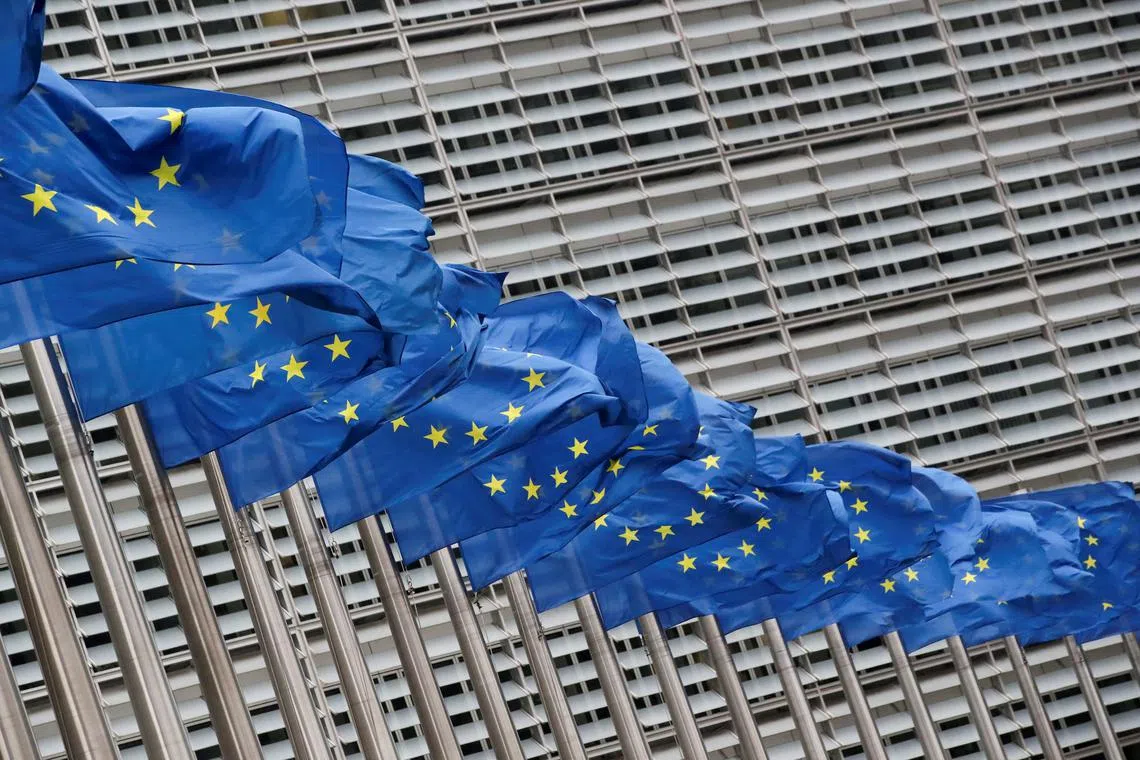 FILE PHOTO: European Union flags flutter outside the EU Commission headquarters in Brussels, Belgium, July 14, 2021. REUTERS/Yves Herman/File Photo