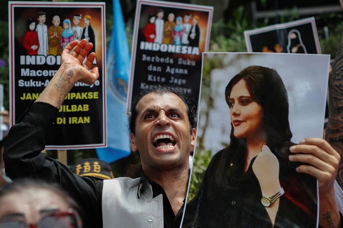 A demonstrator shouts slogans during a protest against the Iranian regime, following the death of Mahsa Amini, outside Embassy of Iran in Jakarta , Indonesia, October 18, 2022. REUTERS/Ajeng Dinar Ulfiana/File Photo