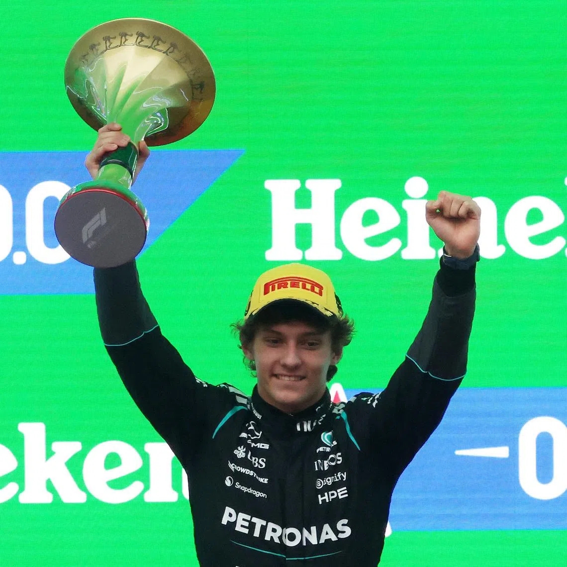 Formula One F1 - Chinese Grand Prix - Shanghai International Circuit, Shanghai, China - March 15, 2026 Mercedes' Andrea Kimi Antonelli celebrates with a trophy on the podium after winning the Chinese Grand Prix REUTERS/Maxim Shemetov
