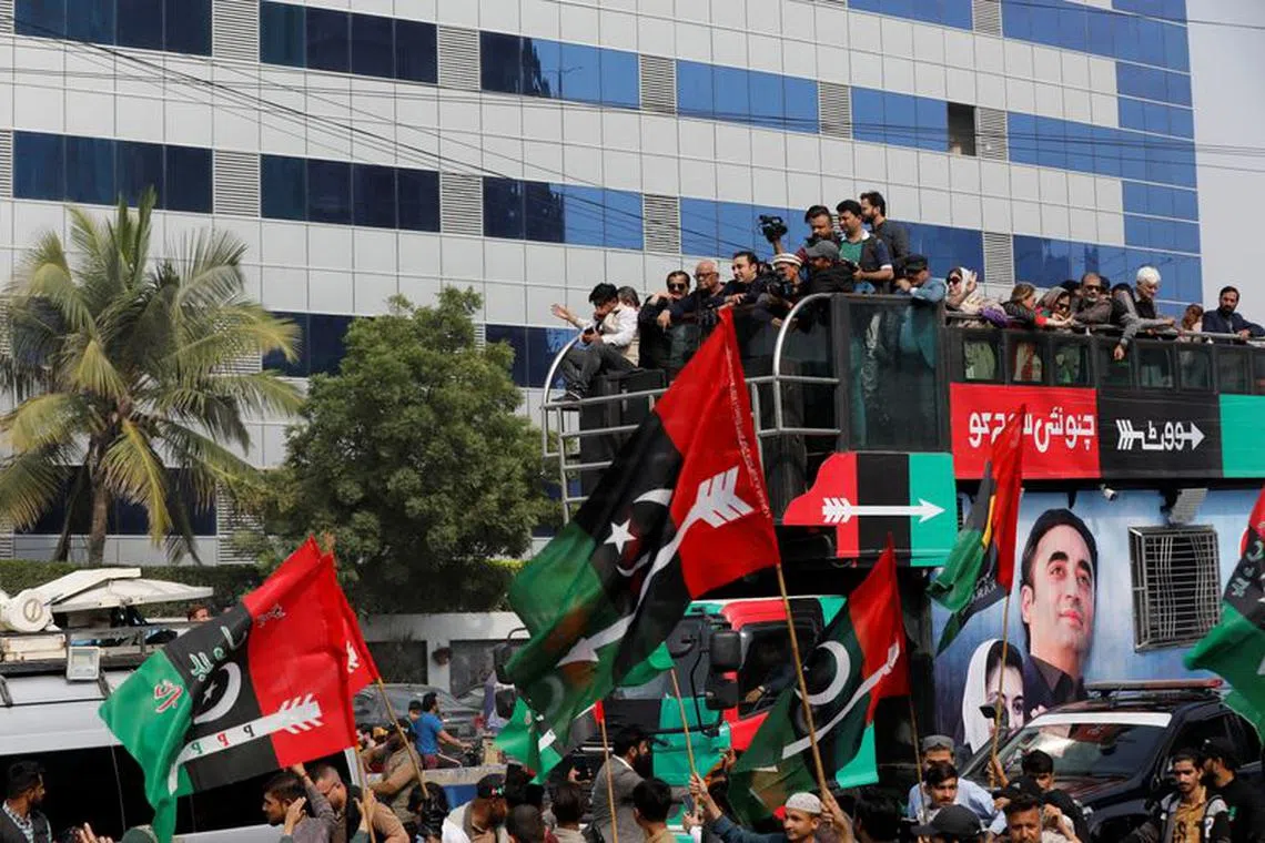Supporters of Bilawal Bhutto Zardari, Chairman of the Pakistan Peoples Party (PPP), gather around his vehicle during an election campaign rally, ahead of the general elections, in Karachi, Pakistan, February 5, 2024. REUTERS/Akhtar Soomro