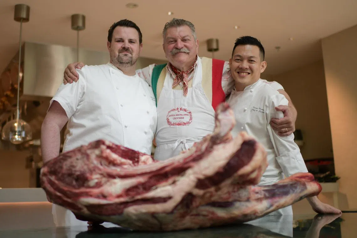 (From left) Bottega di Carna steakhouse's executive chef Alastair Clayton and chef de cuisine Kenny Huang, with famed butcher Dario Cecchini (centre).