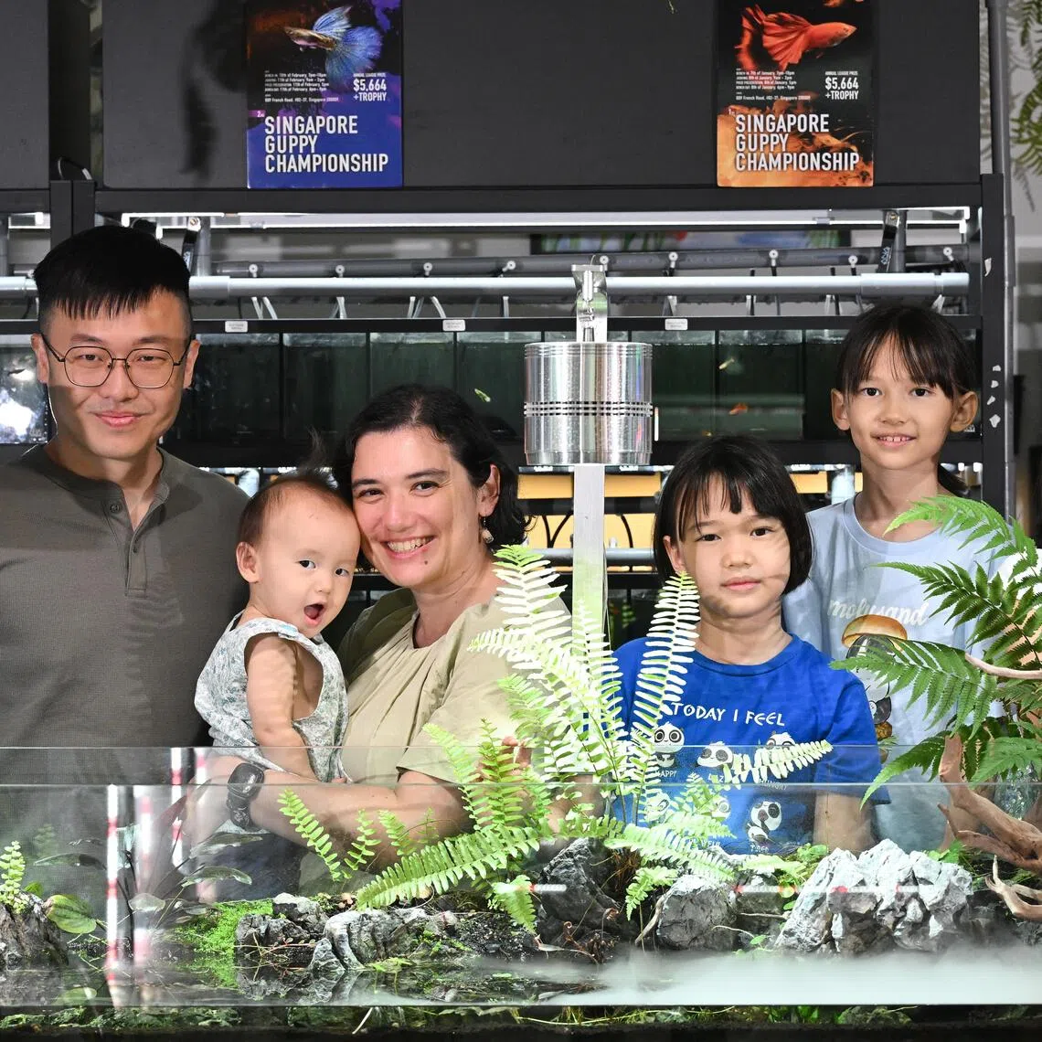 ST20250906-202542000129-Lim Yaohui-Venessa Lee-vllarge/

Mr Jonathan Poh​, 42​, Owner of ​Nature Therapy Studio​, and his wife, Ms Selena Vera Hey​, 41​, ​Teacher​, with their four daughters, Naomi Helen Poh Yi Qing​, (second from right) 8, ​pri​mary ​three pupil; Natalie Susan Poh Yi Ning​, (third from right) 7​, pri​mary ​one pupil; Natasha Eunice Poh Yi Ling​, (extreme right) 3​, in ​nursery two; and Nadya Francine Poh Yi Ting​, ​1, at his shop in Kitchener Complex​ on Sept 6, 2025. 

The govt's Large Families Scheme credits kick off in Sept. Interview with parents of large families, defined as having 3 or more kids, about their bargain-hunting, money-saving tips for large families

(ST PHOTO: LIM YAOHUI)