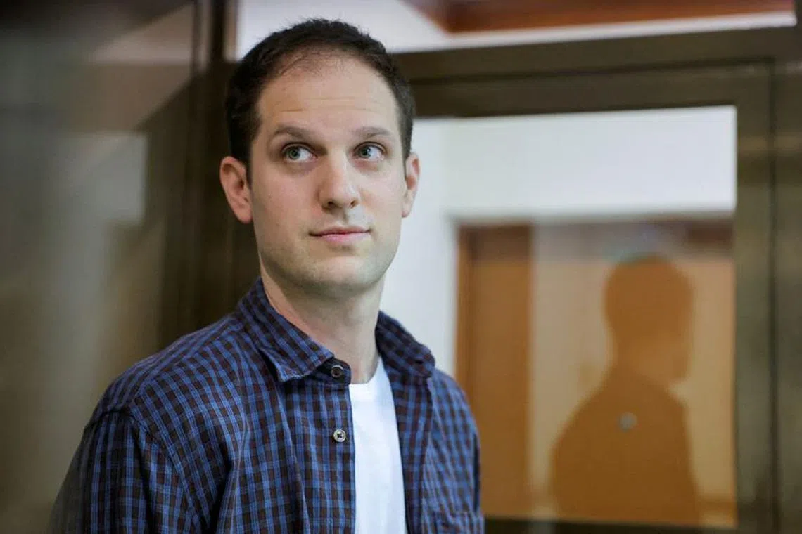 FILE PHOTO: Wall Street Journal reporter Evan Gershkovich stands inside an enclosure for defendants before a court hearing to consider an appeal against his pre-trial detention on espionage charges in Moscow, Russia, October 10, 2023. REUTERS/Evgenia Novozhenina/File Photo