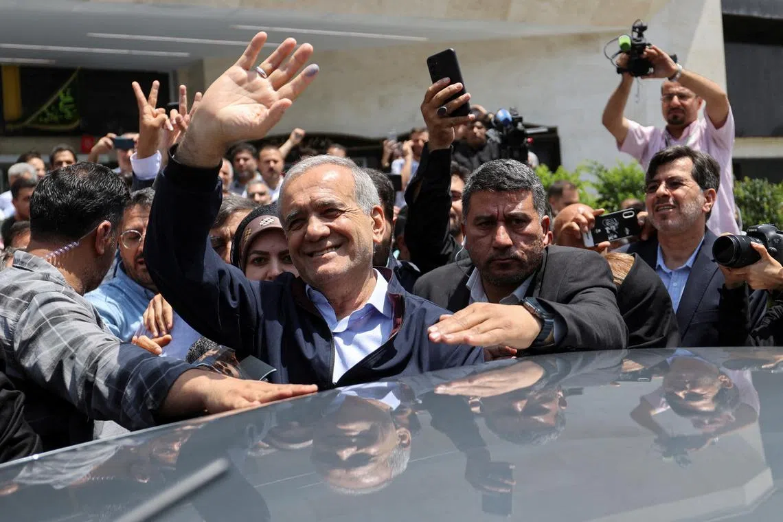 FILE PHOTO: Presidential candidate Masoud Pezeshkian waves to supporters on the day of the presidential election to choose a successor to Ebrahim Raisi following his death in a helicopter crash, in Tehran, Iran June 28, 2024.Majid Asgaripour/WANA (West Asia News Agency) via REUTERS ATTENTION EDITORS - THIS PICTURE WAS PROVIDED BY A THIRD PARTY/File Photo
