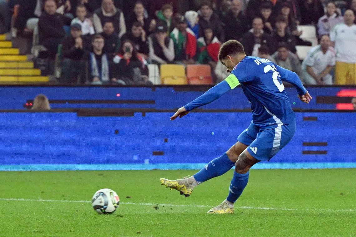Italy defender Giovanni di Lorenzo scores his team's fourth goal in the 4-1 Nations League win over Israel.