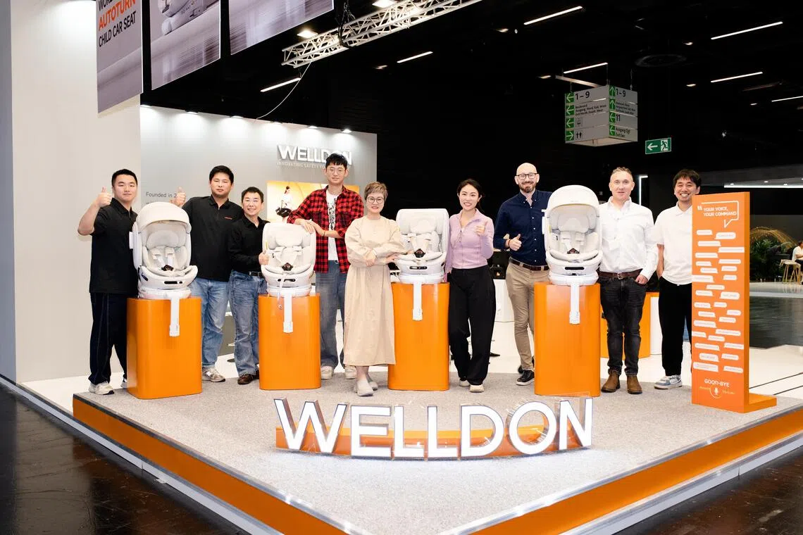 Welldon founder Monica Lin (centre) with her colleagues at the company’s booth at a baby and toddler products trade fair in Cologne, Germany, in Sept 2026.