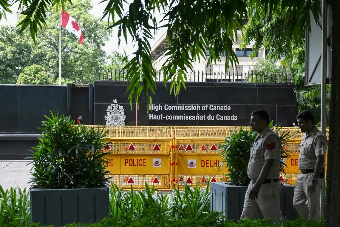 Security personnel stand guard in front of the High Commission of Canada in New Delhi on September 19, 2023.
