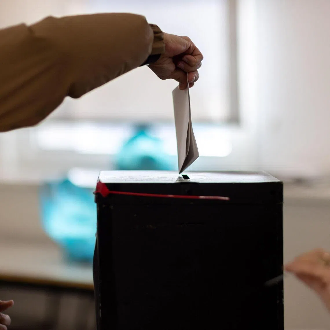 Exit polls and first partial results showed two candidates are heading into a runoff in February.