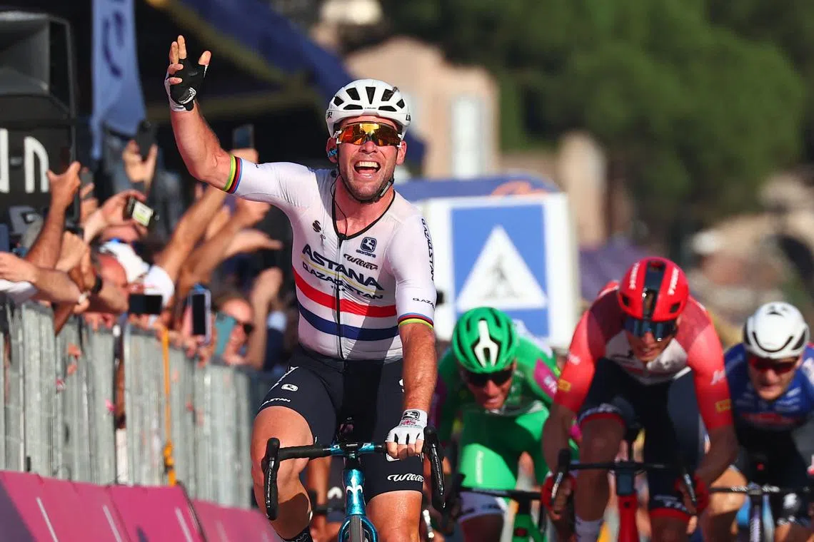Astana Qazaqstan Team's British rider Mark Cavendish celebrating as he crosses the finish line to win the 21st and last stage of the Giro d'Italia 2023