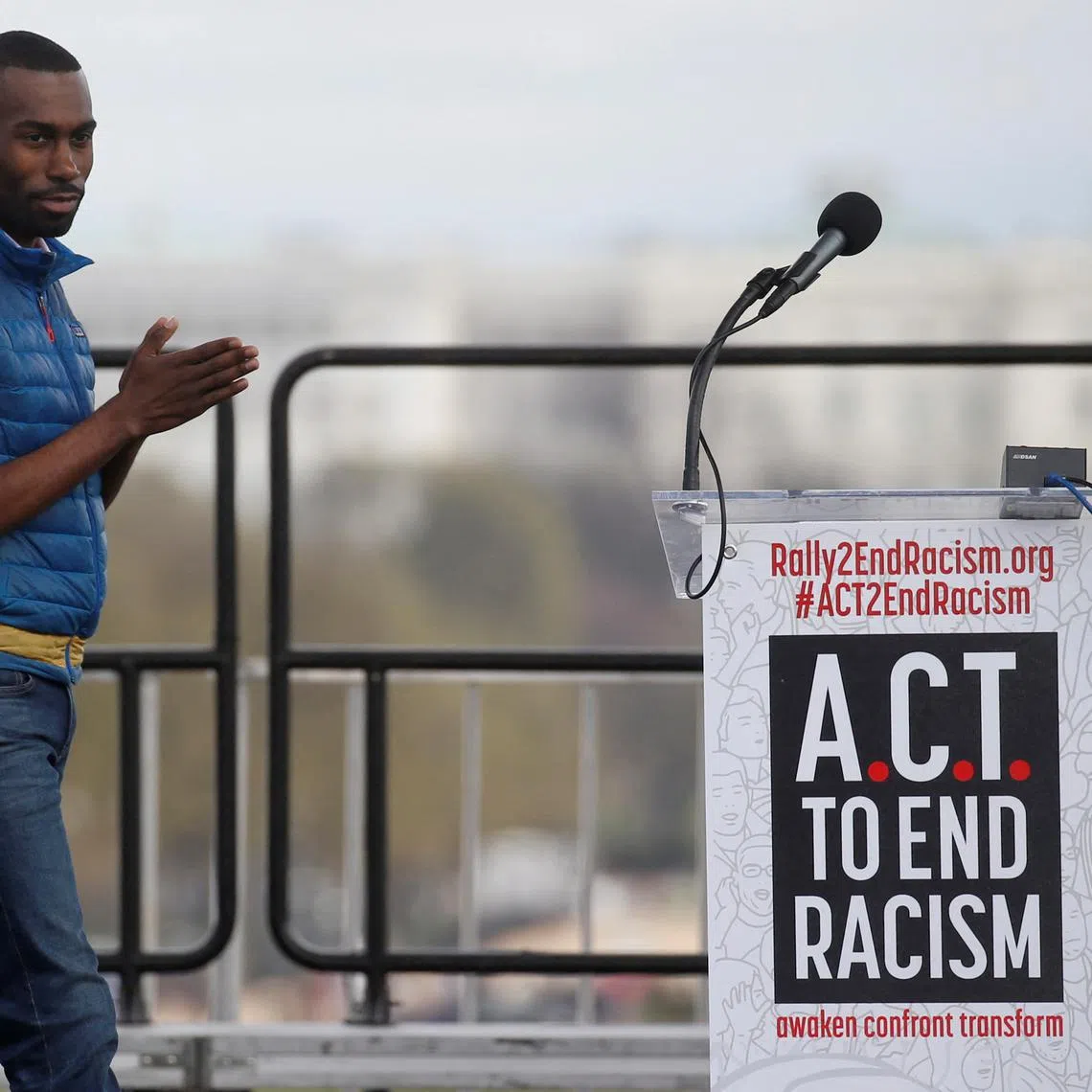 FILE PHOTO: Civil rights activist DeRay Mckesson walks to the lectern to speak during the \"End Racism Rally\" on the 50th anniversary of the assassination of civil rights leader Rev. Martin Luther King Jr. on the National Mall in Washington, U.S., April 4, 2018. REUTERS/Leah Millis/File Photo