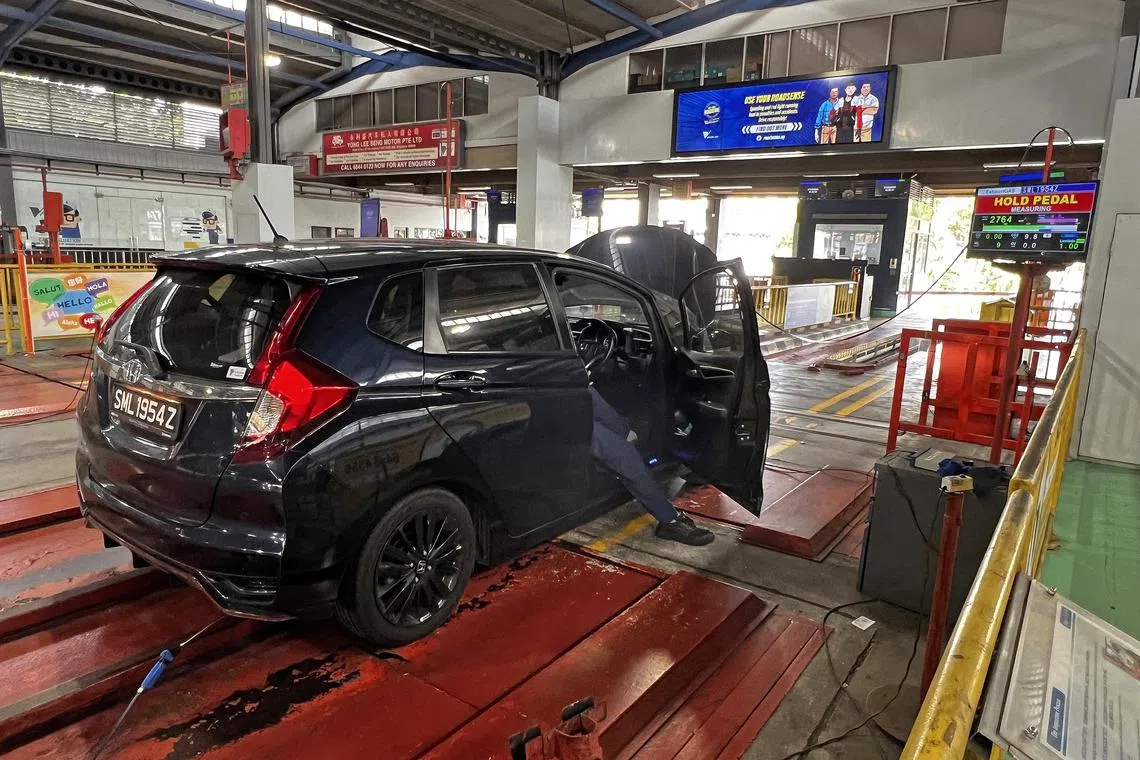 A car at the STA Inspection Centre in Sin Ming undergoing headlight, exhaust emission and sound level tests on March 27, 2024.

Can be used for vehicle inspection, emission test, climate