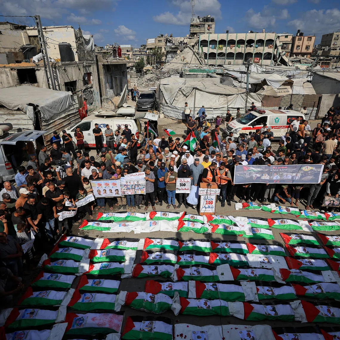 FILE PHOTO: Palestinians attend the mass funeral for members of the Irahem, Malaka, Qanbour, Balawi and Dahdouh families, who were killed in an Israeli strike in 2023 and whose remains were recovered from beneath the rubble, according to Gaza’s Civil Defense, in Gaza City, September 6, 2026. REUTERS/Dawoud Abu Alkas/File Photo