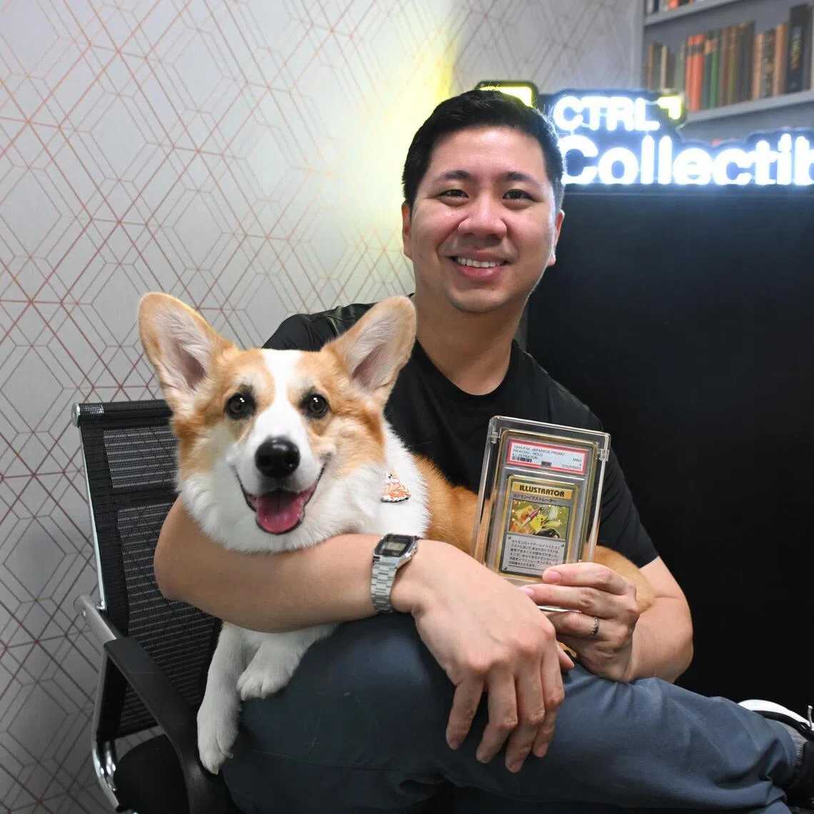 ST20251222_202586800795 alpokemon Azmi Athni//

Me & My Money interview with Mr Chew Zhan Lun, 33, Pokémon card collector and co-founder of CTRL Collectibles, with his pet corgi Sushi, and his $1.3 million Pokémon card, on Dec 22, 2025. 

ST PHOTO: AZMI ATHNI
