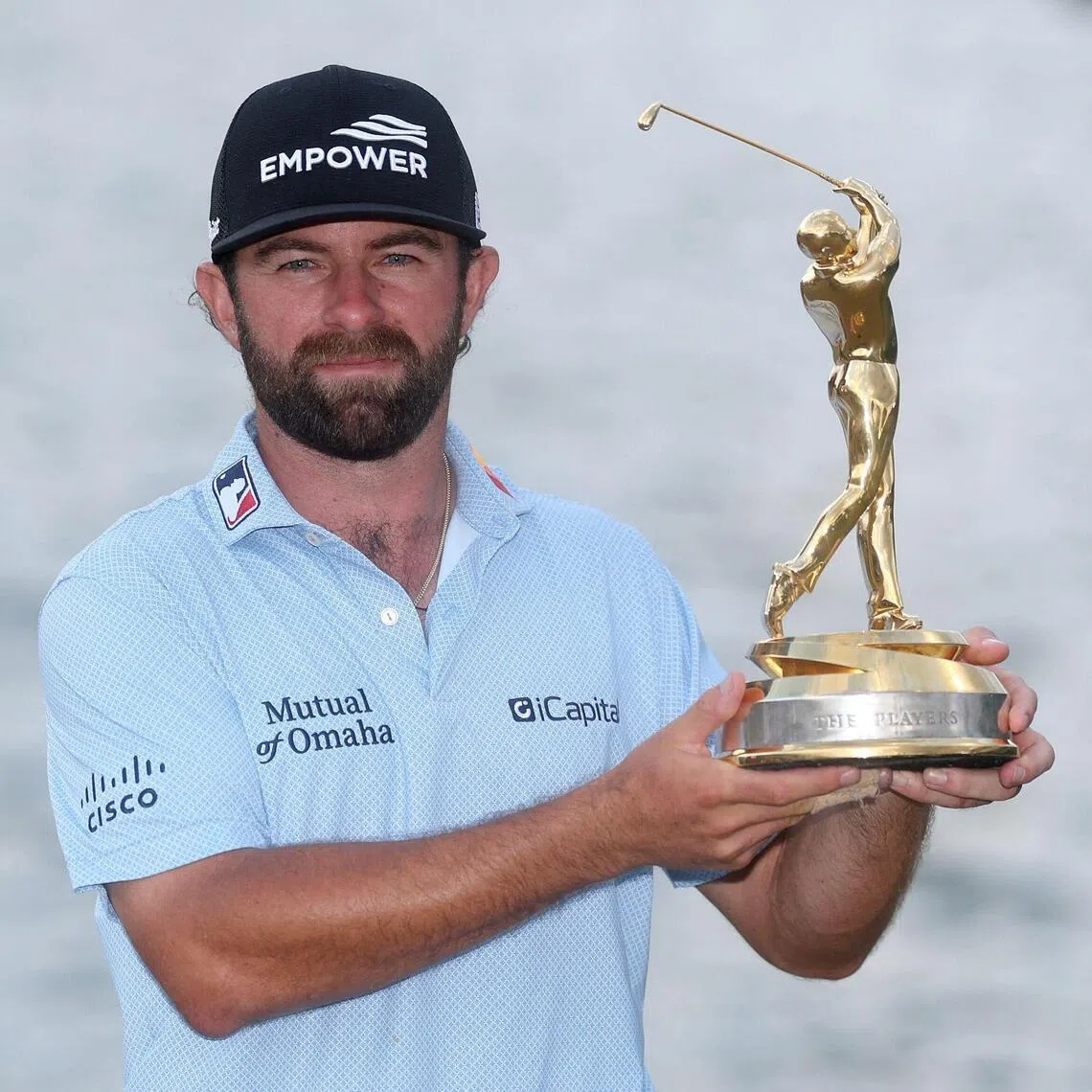 Cameron Young of the US holding the Players Championship trophy after his one shot win over England’s Matt Fitzpatrick at TPC Sawgrass on March 15, 2026 in Ponte Vedra Beach, Florida. 