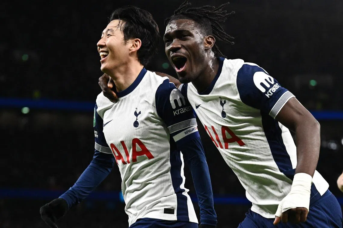 Tottenham Hotspur's Son Heung-min celebrates scoring their fourth goal with Yves Bissouma.