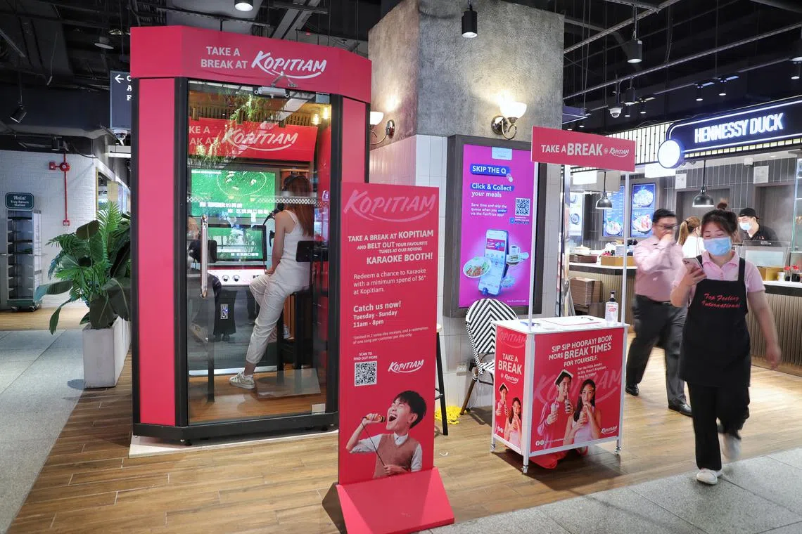 A roving karaoke booth at the Kopitiam food hall in JEM on Nov 11, 2022. The booth will be rotated between five outlets from 11am to 8pm.