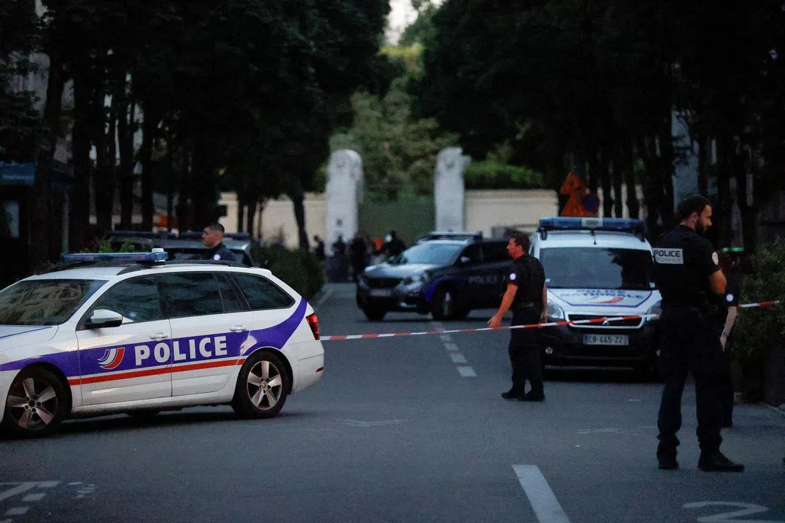 FILE PHOTO: Police officers work at the scene after a car hit people sitting on a terrace in front of a restaurant in Paris, France July 17, 2024. REUTERS/Abdul Saboor/File Photo
