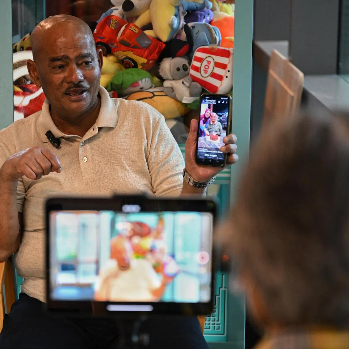 Mr Akbar Abdul Kader recording his legacy video at Oasis @ Outram day hospice on Dec 28, 2023.
In Singapore, where death and dying are still rarely discussed, a small group of patients are making legacy videos for their families. Senior digital ambassadors from non-profit orgn Wings have been producing such videos for patients at the end of their lives, including those from the day hospice Oasis@Outram.