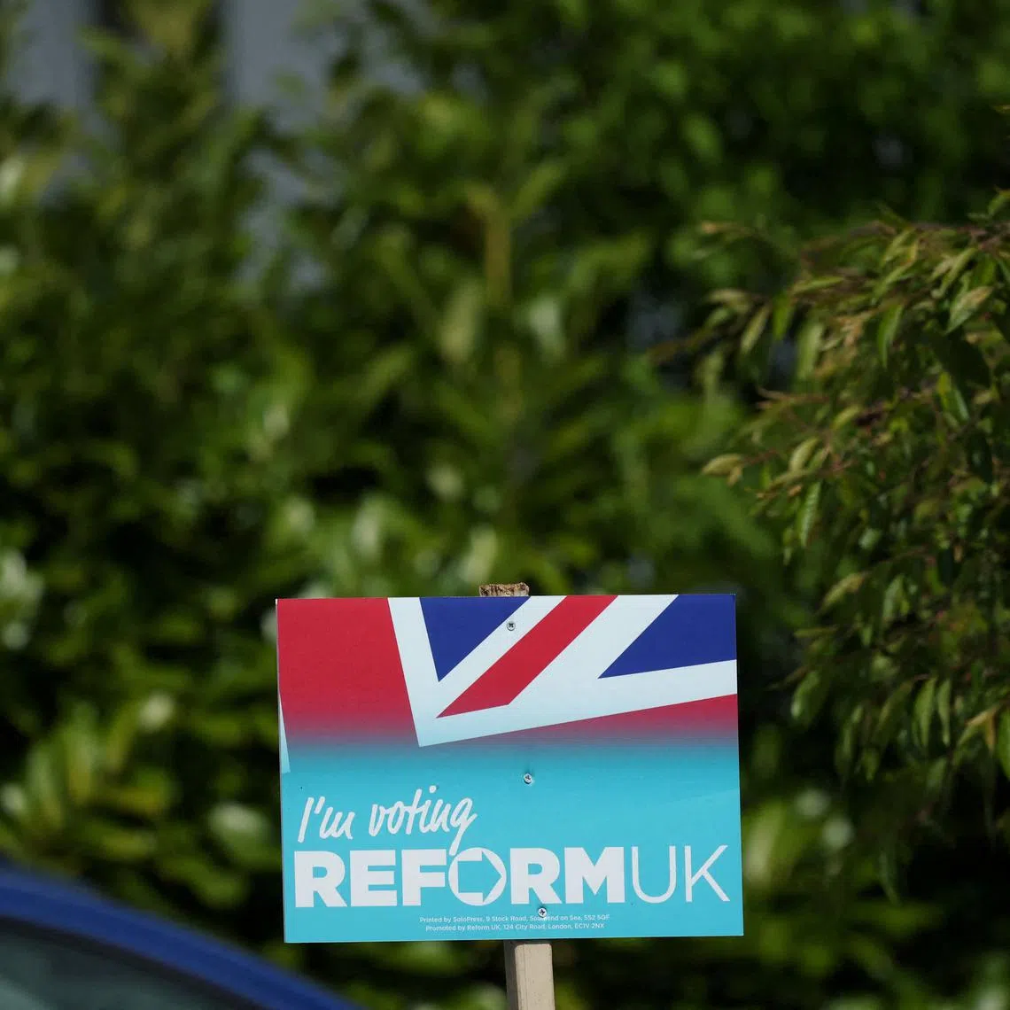 FILE PHOTO: A Reform UK party poster is seen outside a house ahead of the forthcoming Runcorn and Helsby parliamentary by-election in Frodsham, Britain, April 25, 2025. REUTERS/Phil Noble/File Photo
