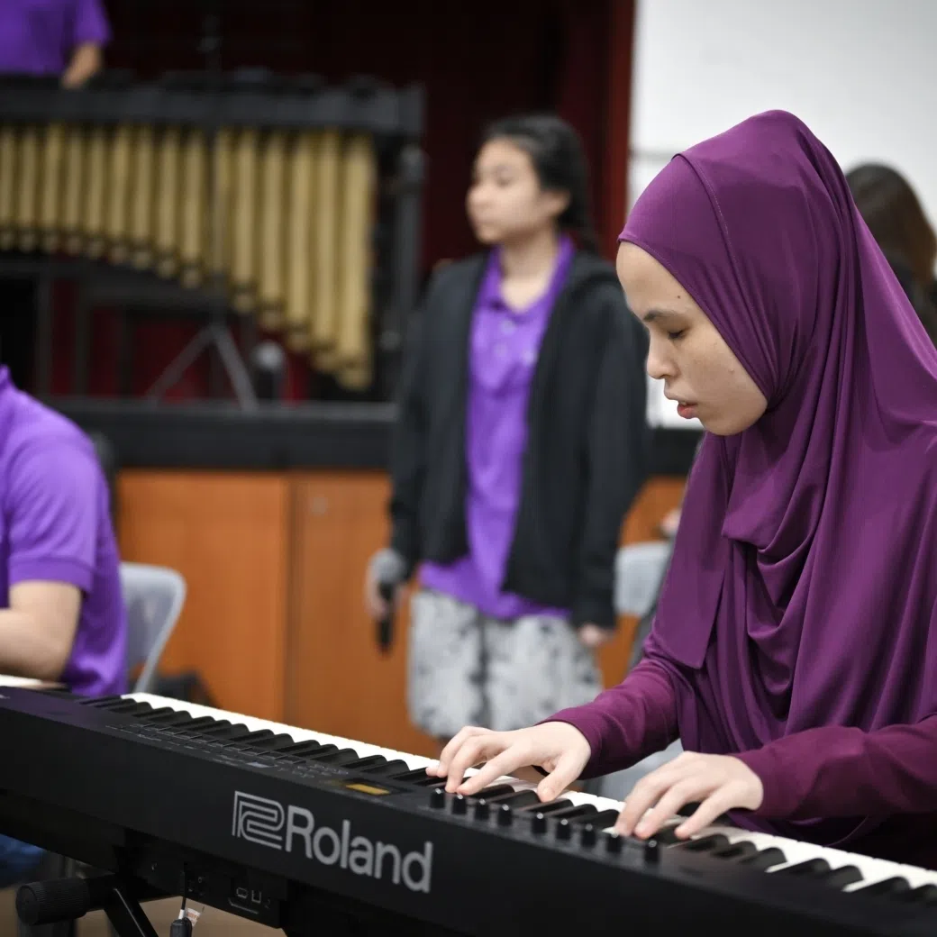 Ms Siti Sakinah Zainal, 29, who is blind and started learning the piano by playing along to her father singing Malay songs, begins one of The Purple Symphony’s songs.