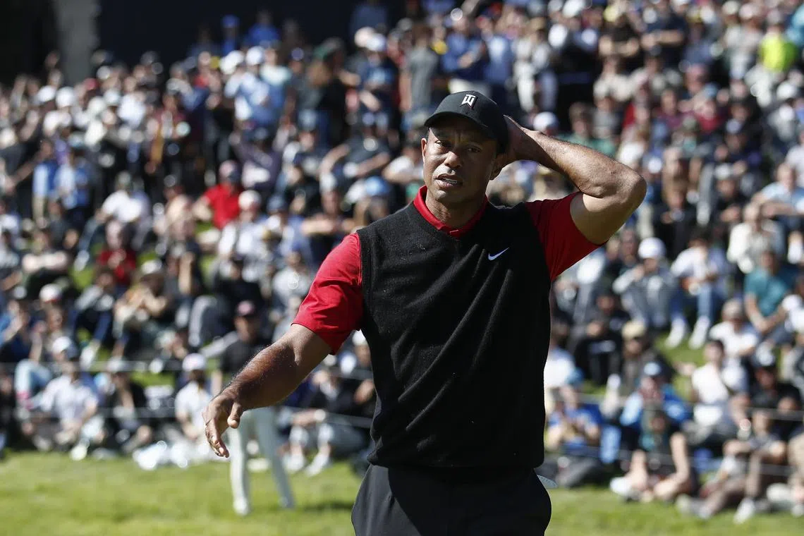 Tiger Woods uses a feminine hygiene product as a prop in a boys-only joke.
